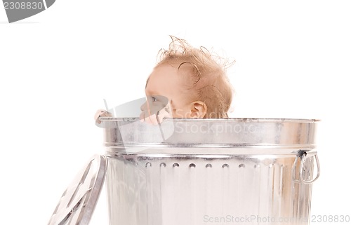Image of baby in trash can