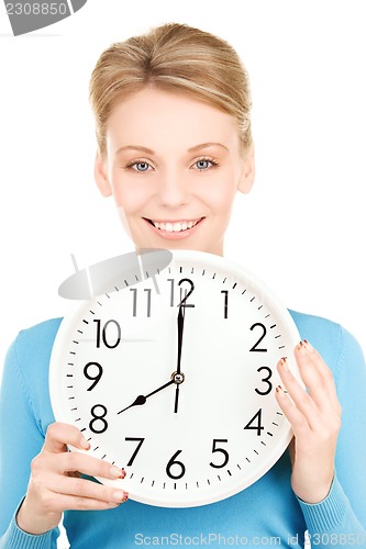 Image of woman holding big clock