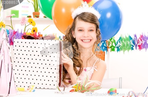 Image of party girl with balloons and gift box