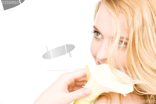 Image of beautiful woman with white flower