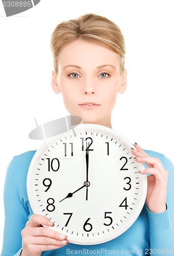 Image of woman holding big clock