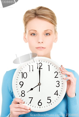 Image of woman holding big clock