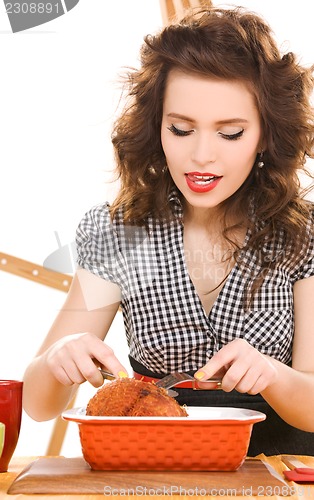 Image of young attractive woman in the kitchen