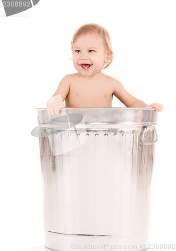 Image of baby in trash can