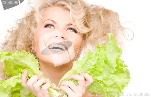 Image of happy woman with lettuce