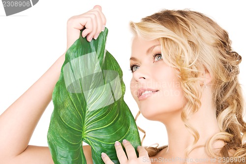 Image of woman with green leaf