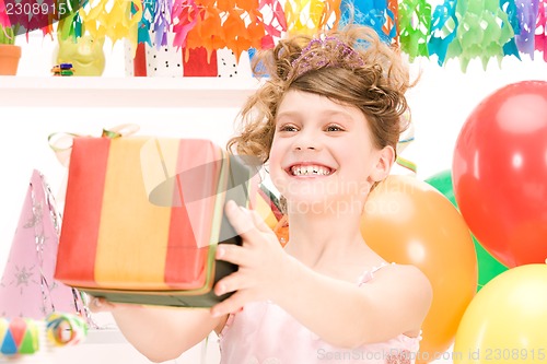 Image of party girl with balloons and gift box