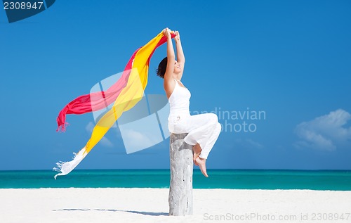 Image of happy woman on the beach