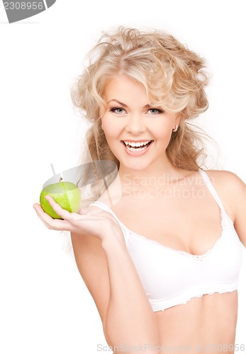 Image of young beautiful woman with green apple