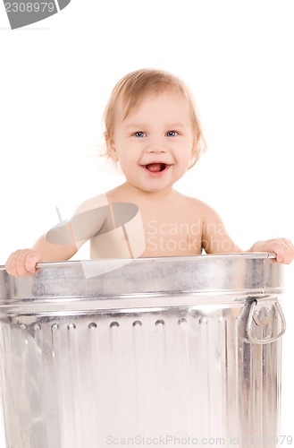 Image of baby in trash can