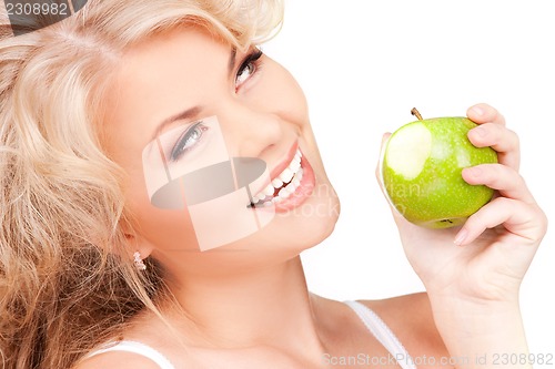 Image of young beautiful woman with green apple