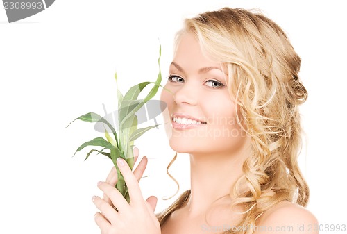 Image of woman with bamboo