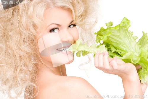 Image of happy woman with lettuce