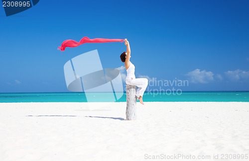 Image of happy woman on the beach