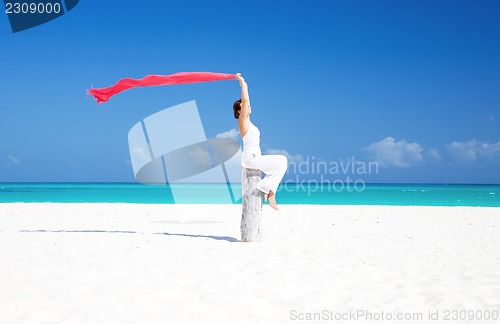 Image of happy woman on the beach