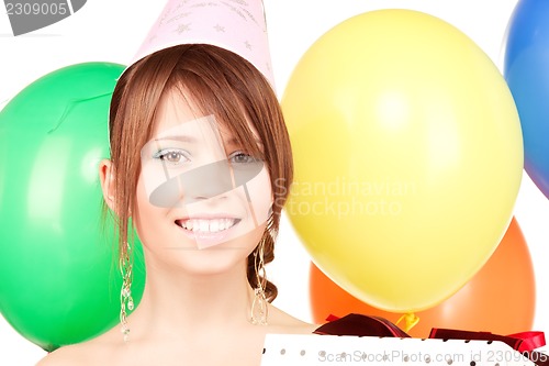 Image of party girl with balloons and gift box