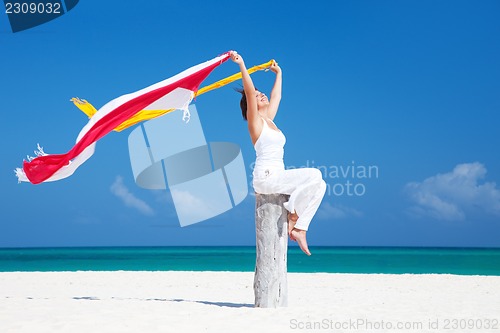 Image of happy woman on the beach