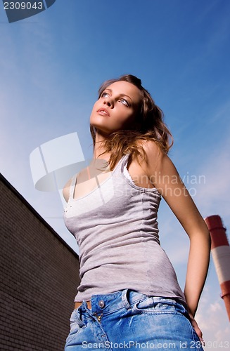 Image of young sexy woman in blue jeans