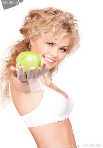 Image of young beautiful woman with green apple