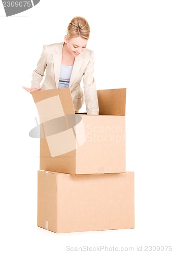 Image of businesswoman with boxes