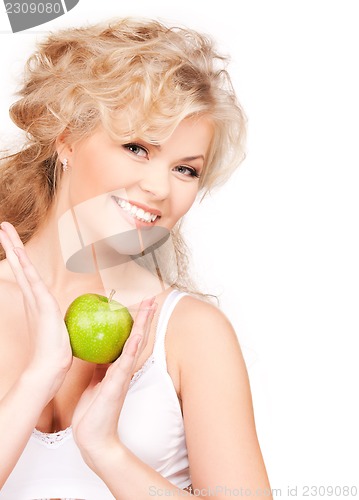 Image of young beautiful woman with green apple