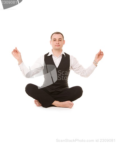 Image of businessman sitting in lotus pose