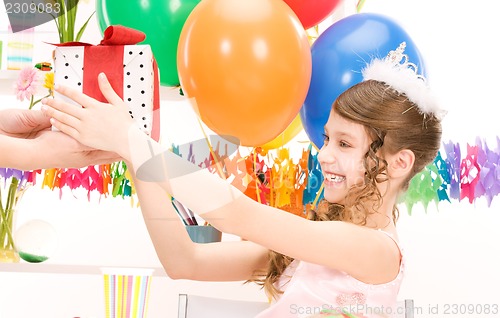 Image of party girl with balloons and gift box