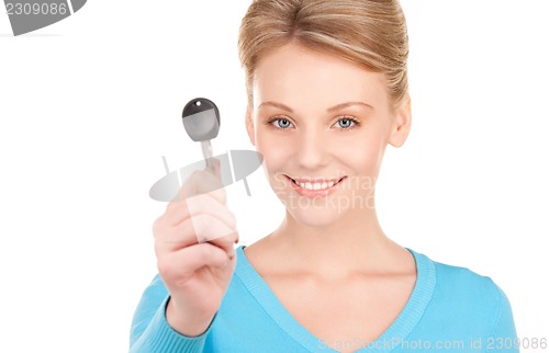 Image of happy woman with car key