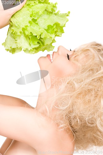 Image of happy woman with lettuce