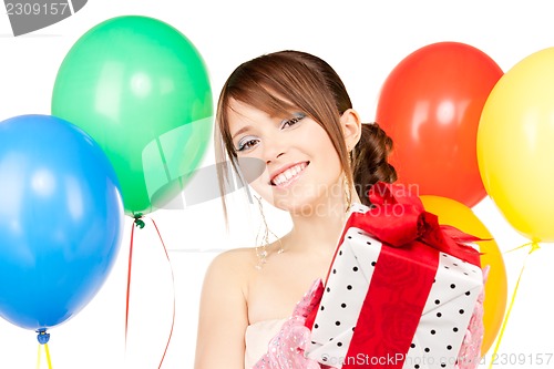 Image of party girl with balloons and gift box