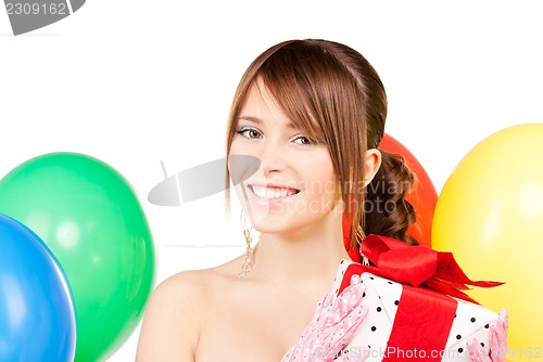 Image of party girl with balloons and gift box