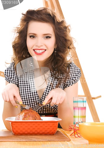 Image of young attractive woman in the kitchen