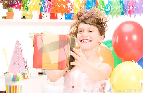 Image of party girl with balloons and gift box