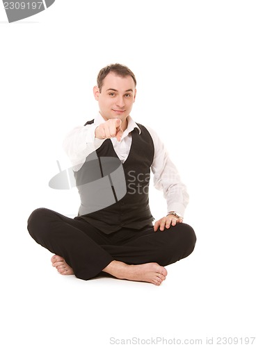 Image of businessman sitting in lotus pose