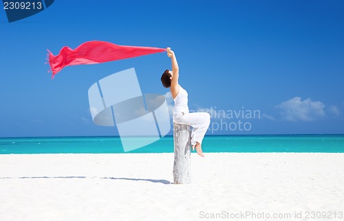 Image of happy woman on the beach