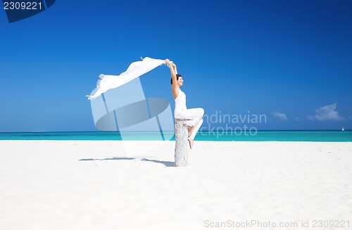 Image of happy woman on the beach