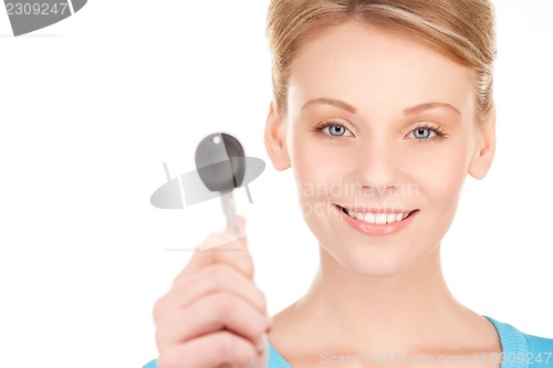 Image of happy woman with car key