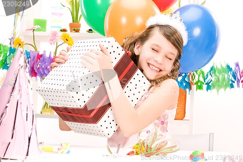 Image of party girl with balloons and gift box