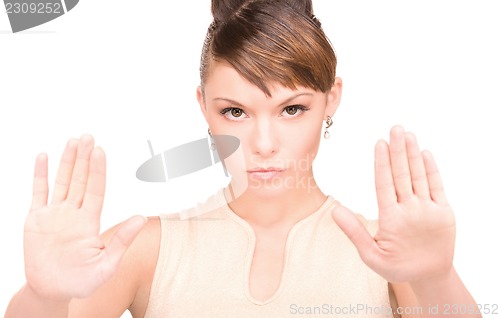 Image of woman making stop gesture