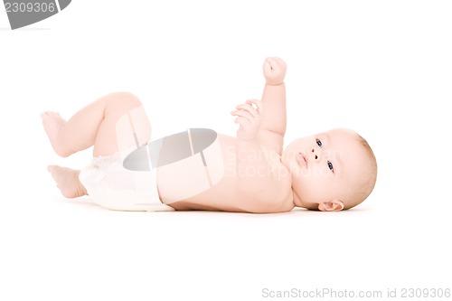 Image of laying baby boy in diaper