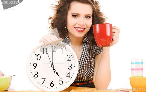 Image of young attractive woman in the kitchen