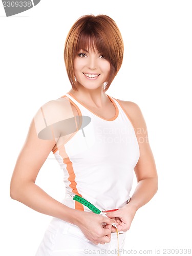 Image of beautiful woman with measure tape