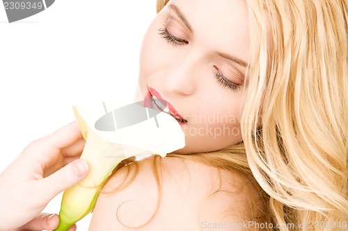 Image of beautiful woman with white flower