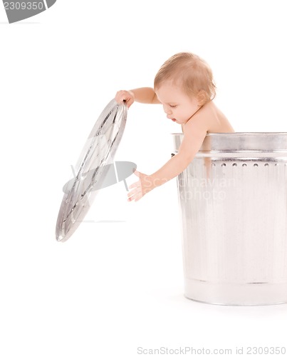 Image of baby in trash can