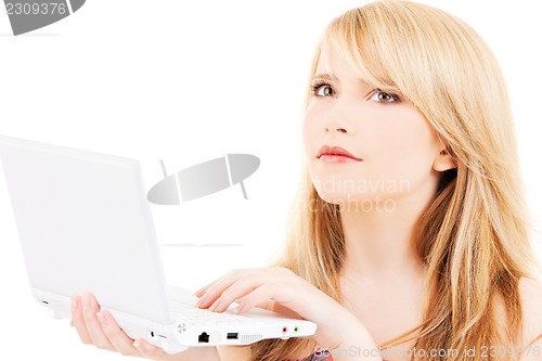 Image of teenage girl with laptop computer