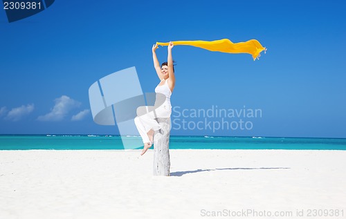 Image of happy woman on the beach