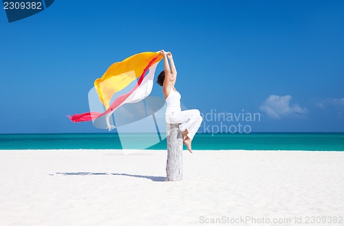 Image of happy woman on the beach