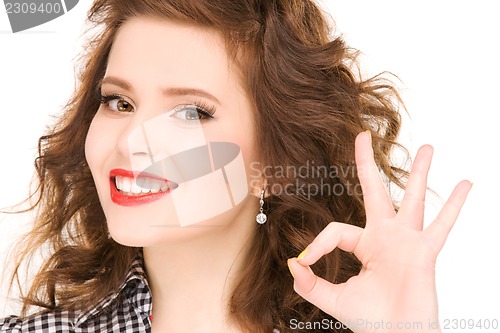 Image of lovely woman showing ok sign