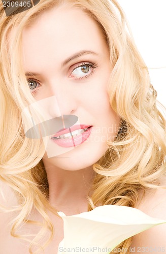 Image of beautiful woman with white flower