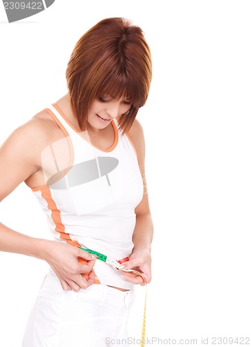 Image of beautiful woman with measure tape